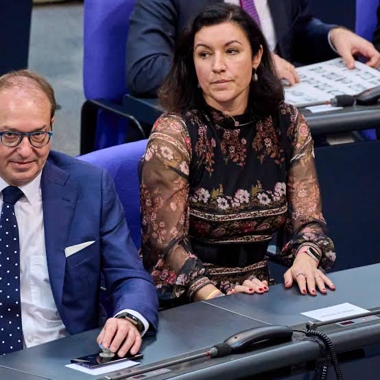 Dorothee Bär seated in the plenary chamber of the Bundestag beside Alexander Dobrindt