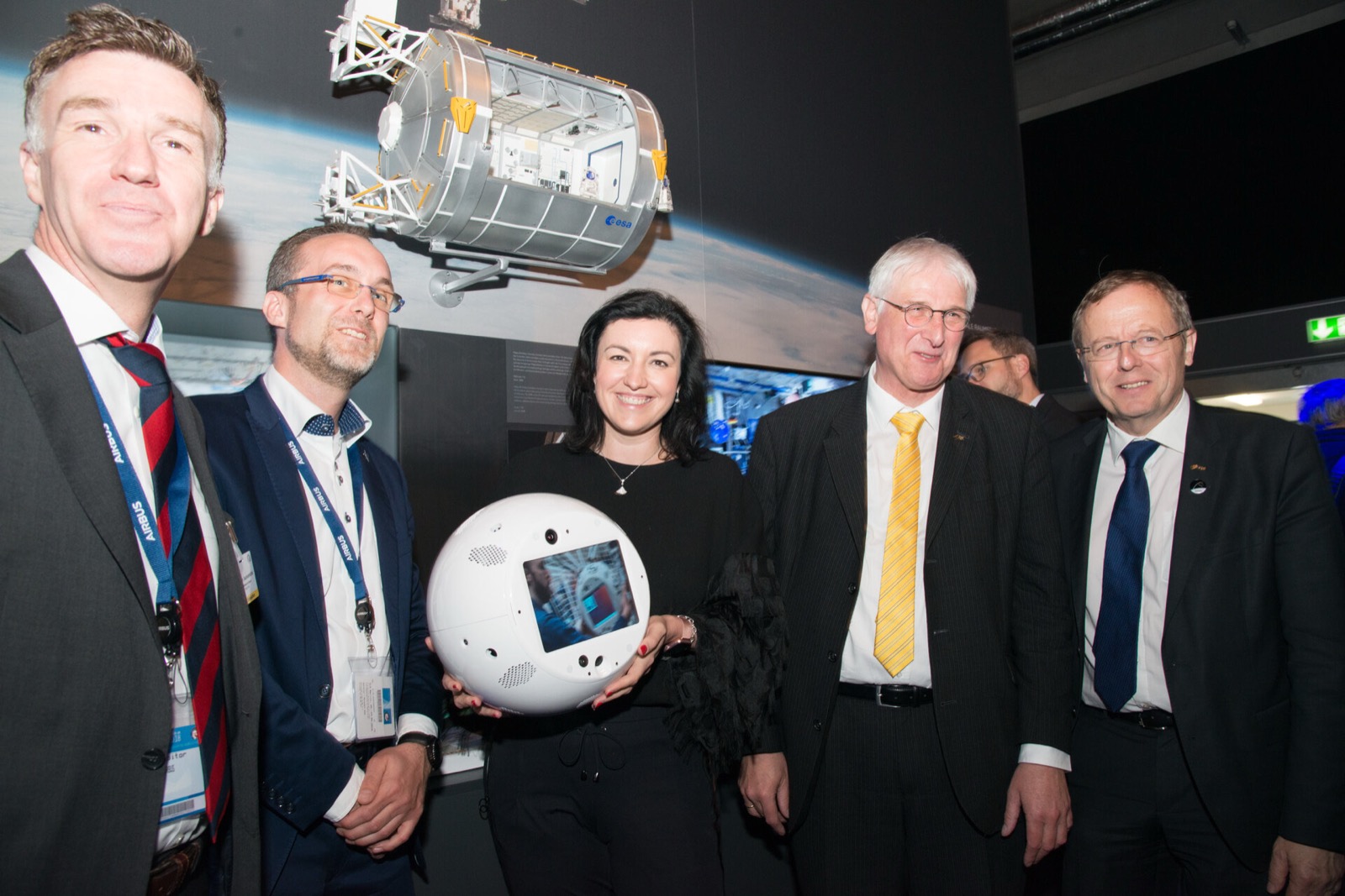 Dorothee Bär holding a model of the CIMON robotic assistant, with then ESA Director General Jan Wörner, at the ILA Space Pavilion in 2018